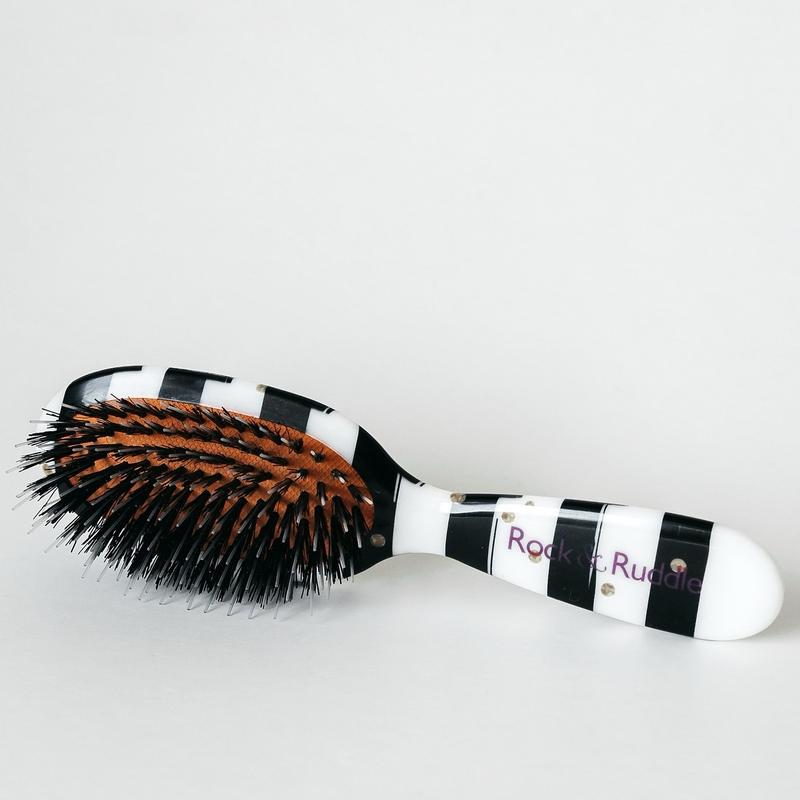 Hairbrush black and white gold dots, boar bristle. Removable brush pad. Slides through tangles great hair care brush!