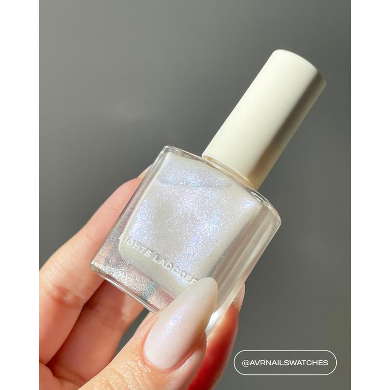 Voulez-Vous  - Soft off-white polish with a fine pink and blue shimmer finish